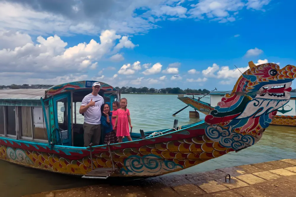 Family on a Traditional Dragon Boat on the Perfume River